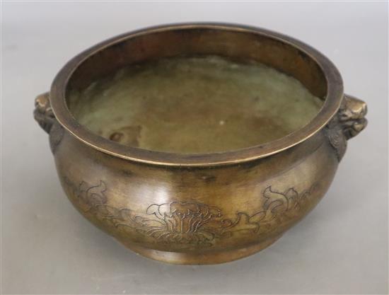 A Chinese bronze censer with lion mask handles, Xuande mark, but later, diameter 16cm